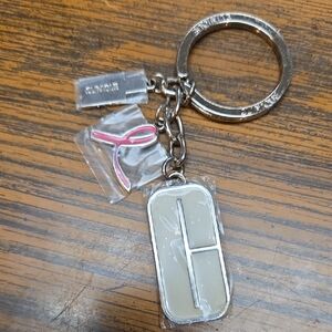 Clinique New Silver and Cream Keychain Accessory